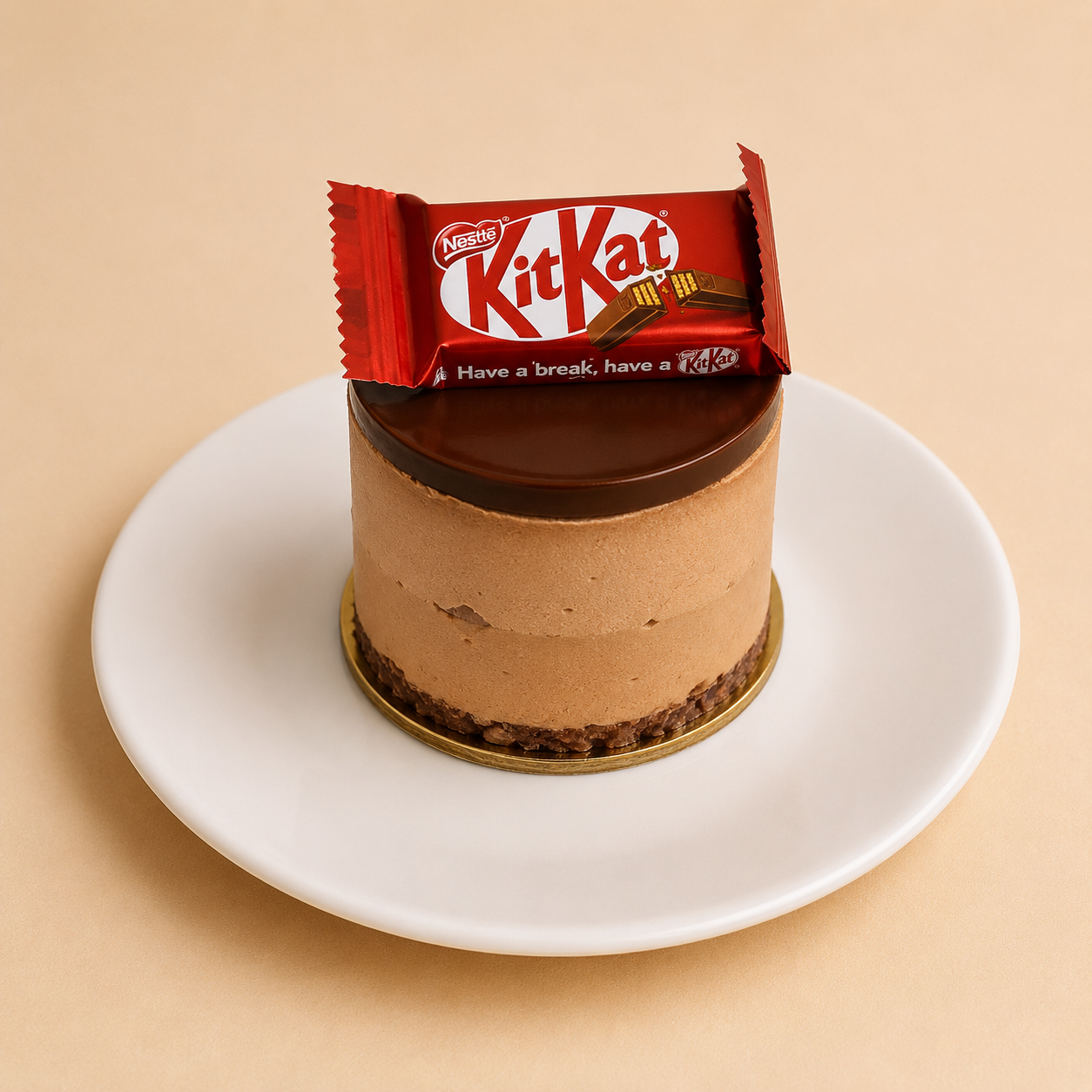 Individual KitKat mousse cake with chocolate ganache and a KitKat bar